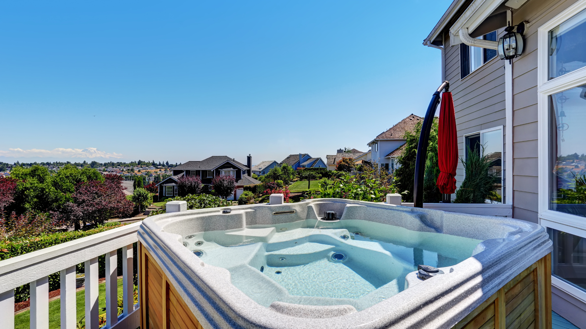 Photo of a hot tub on a deck. Overlooking the neighborhood.