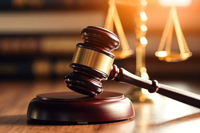 Gavel and scales representing electrical code compliance